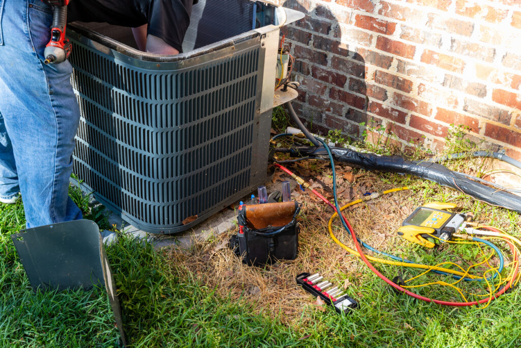 Repair work being done on air conditioner unit